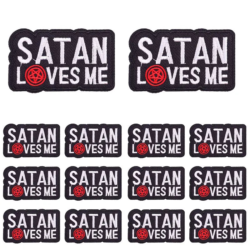 A set of black embroidered patches featuring the slogan Satan Loves Me
