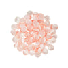 A pile of pink silk rose petals for weddings and events.