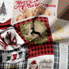 A festive fabric featuring plaid patterns, reindeer silhouettes, and Christmas holiday text.