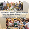 A family enjoying a summer BBQ outdoors with a grill cover nearby.