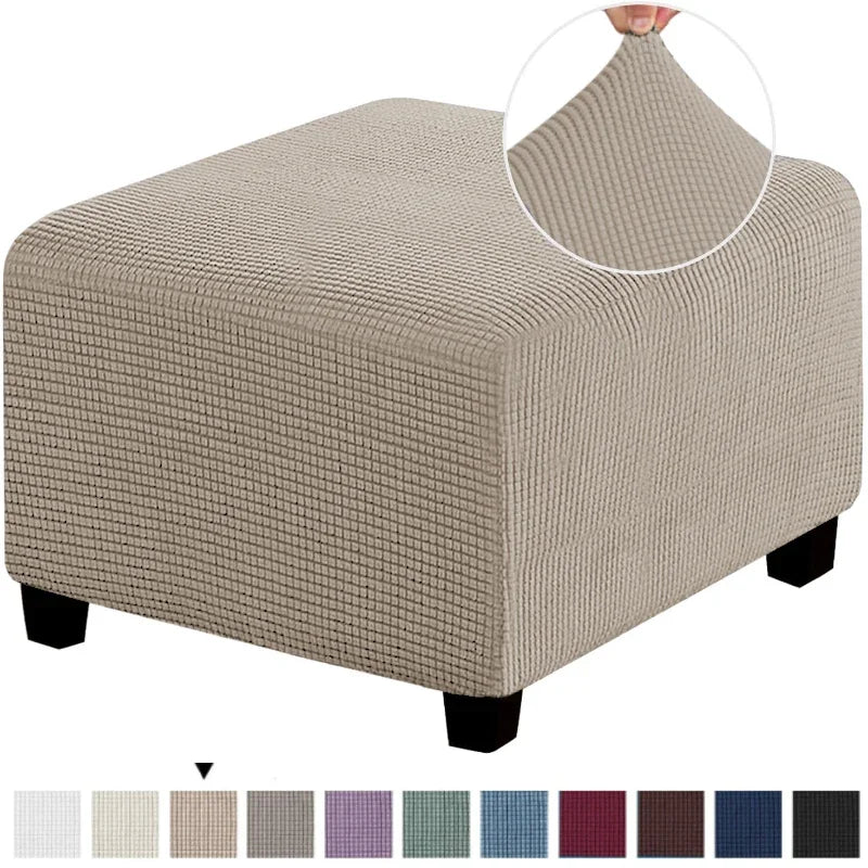 A square jacquard footrest ottoman slipcover in beige fabric with a textured weave.