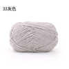 A ball of light gray 3mm matte chenille yarn for knitting and crochet.