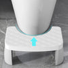 A white adjustable adult toilet squat stool with a padded seat and support arms shown from above.