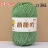 A skein of green chenille yarn is shown, labeled as 6 pieces and 23 strands.