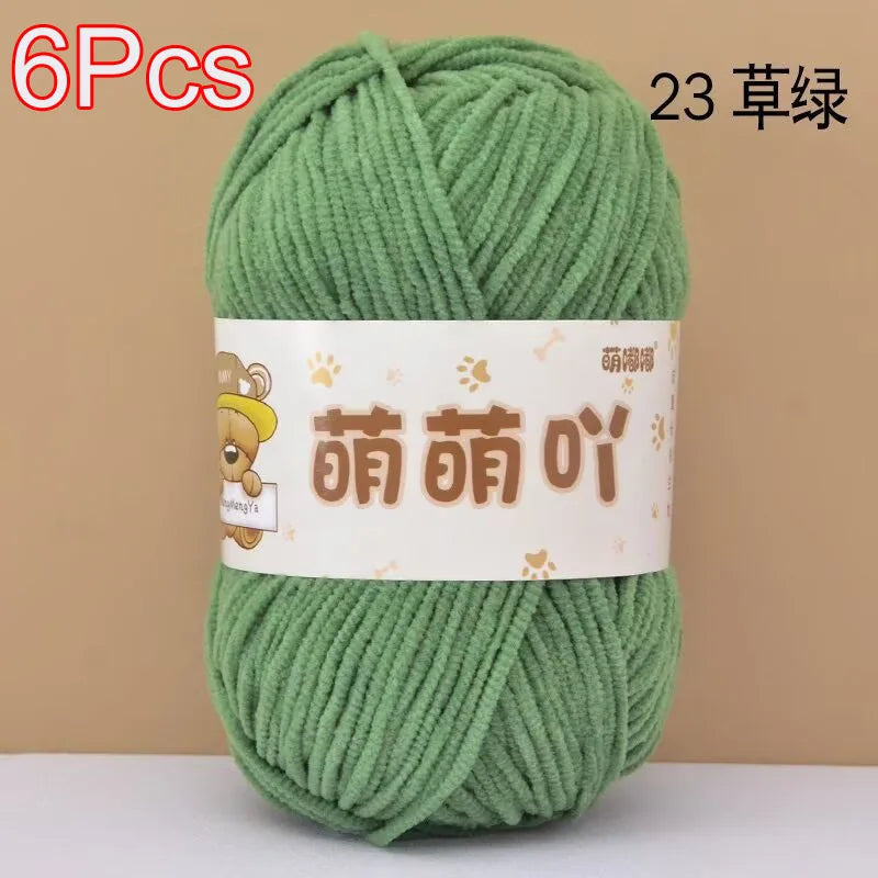 A skein of green chenille yarn is shown, labeled as 6 pieces and 23 strands.