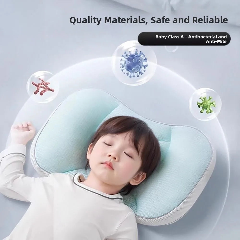 A baby is sleeping comfortably on a light blue reversible breathable newborn sleep pillow.