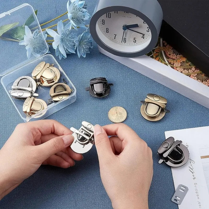 Hands are shown using gold metal twist locks on a bag or case for DIY projects next to a clock.