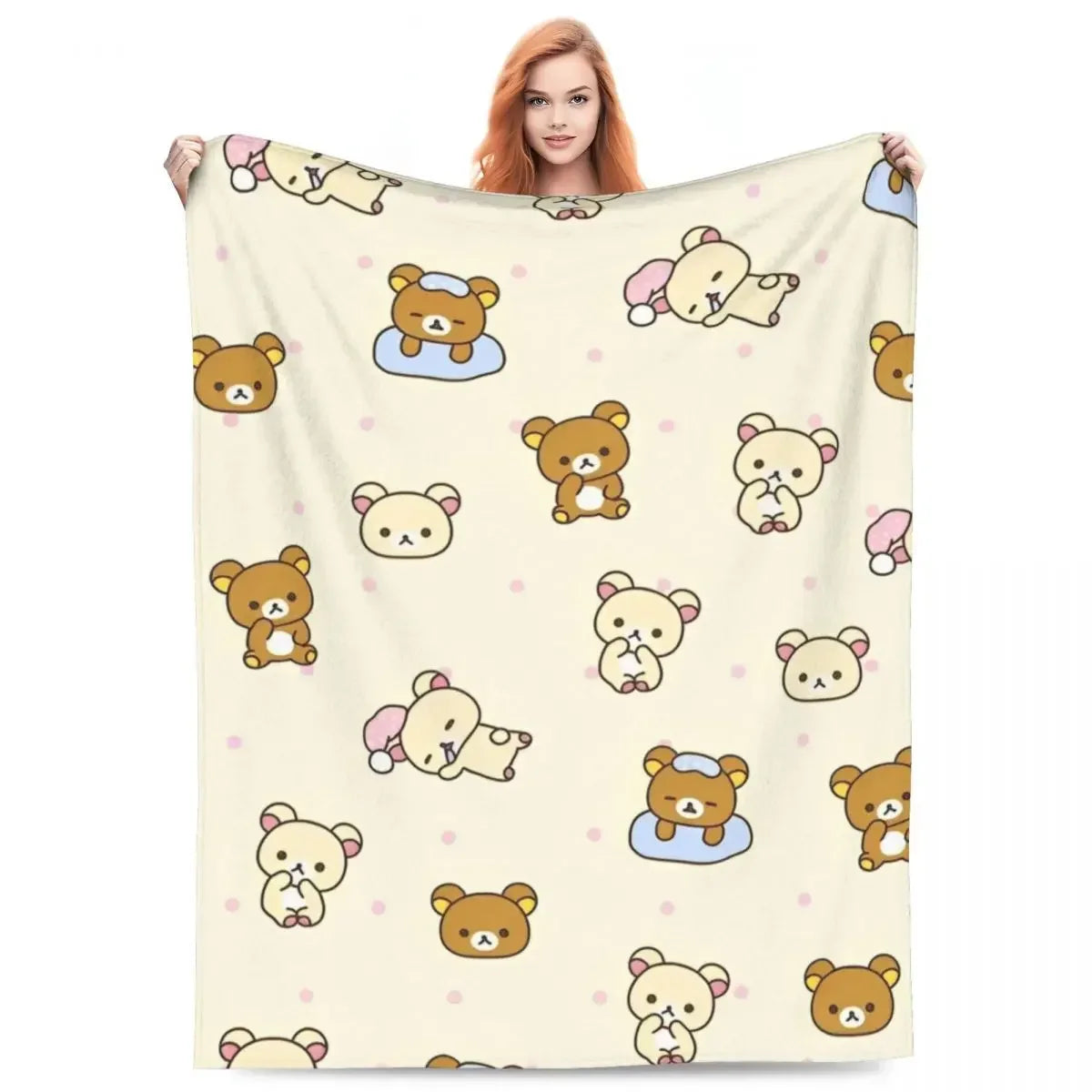 A beige plush throw blanket featuring a pattern of cute cartoon bears and other animals.