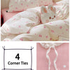 A pink duvet cover set featuring a white background with pink floral patterns and a cute bunny face pillow.