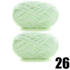 A ball of thick, light green velvet yarn for knitting and crochet projects.