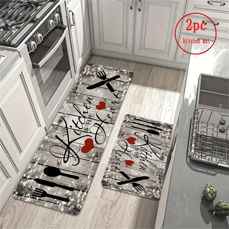 A rectangular kitchen mat featuring a heart design with crossed cutlery on a light wood floor.
