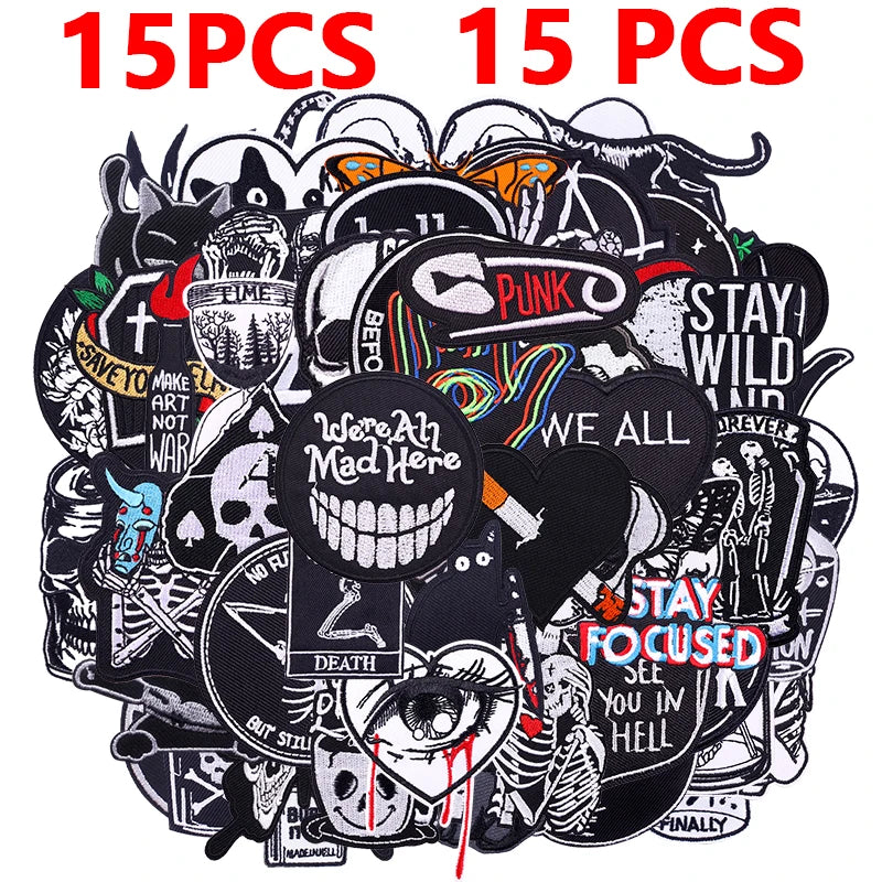 A pile of 15 mixed black and white punk embroidered patches for DIY clothing.
