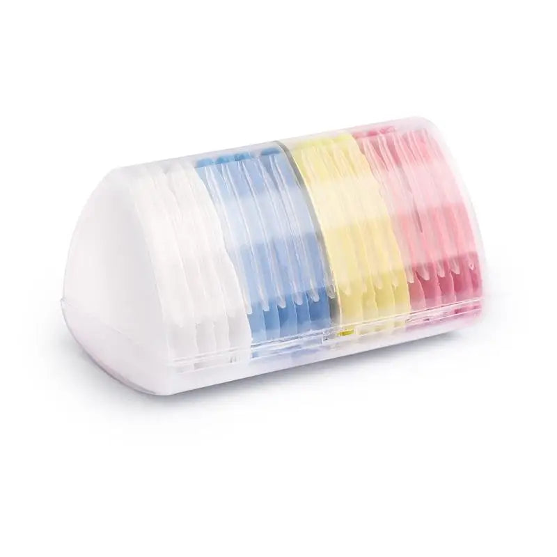 A clear plastic container filled with colorful erasable fabric chalk markers for sewing.