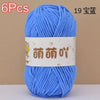 A skein of bright blue chenille yarn labeled as 6 pieces, ready for crochet or knitting projects.