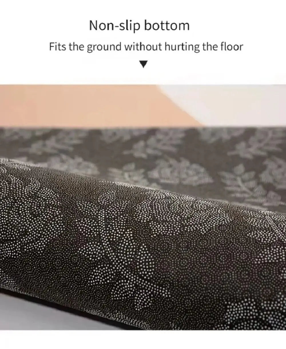 Close-up view of a dark patterned rug showing the non-slip bottom texture.