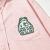 Pink shirt with an embroidered frog patch on the chest that says I have to say weird stuff or I'll die