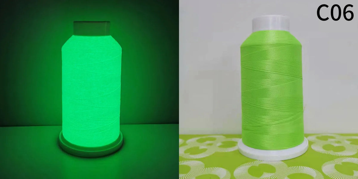 A roll of bright lime green glow in the dark embroidery thread on a white base against a light green background.
