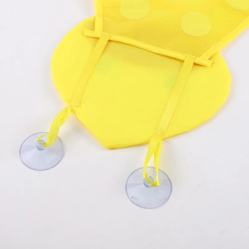 Yellow mesh bath toy organizer featuring adhesive hooks for holding toys