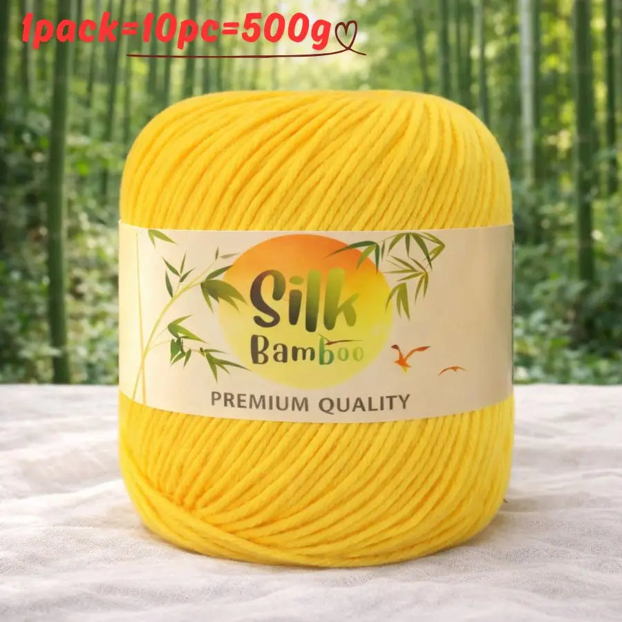 A ball of bright yellow silk bamboo blend yarn with a label indicating premium quality