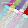 A colorful roll of decorative lace ribbon featuring various shades including pink, purple, green, and blue.