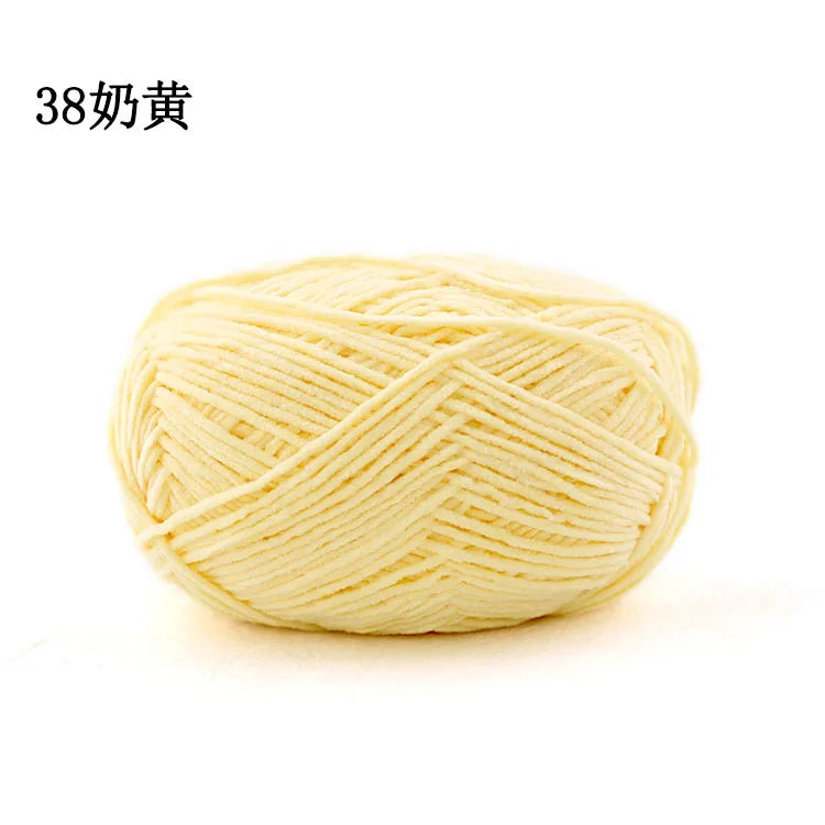 A ball of light yellow matte chenille yarn for knitting and crochet