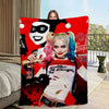 A woman with pink and blue hair wearing a white shirt is featured on a red blanket design.