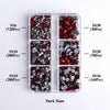 A clear plastic tray containing various sizes of dark glass rhinestones in different colors and quantities.