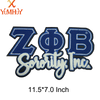 An embroidered patch featuring the letters ZOB and the text Sorority Inc in blue and white thread.