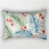 A decorative pillowcase featuring a tropical leaf print with pink and blue floral accents.