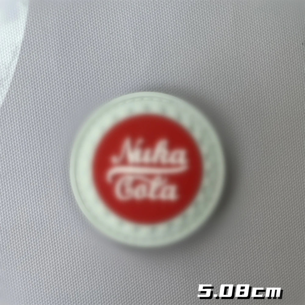 Red embroidered patch with the text Nuka Cola on a white background.