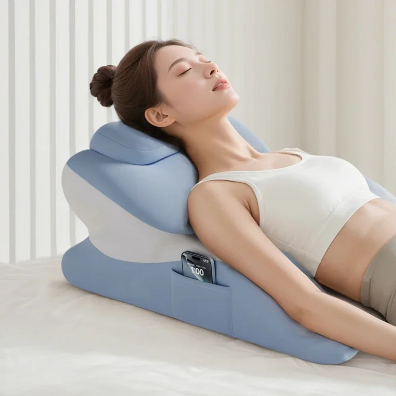 A woman is resting her eyes on a large blue memory foam body pillow for comfort.