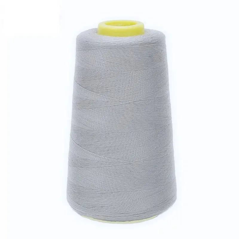 A roll of gray premium sewing thread with a yellow core.