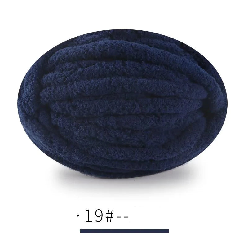 A ball of dark navy blue, extra thick hand-knitted yarn for crafting and gifts.