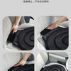 A black rotating car seat cushion is shown being placed into a car seat for improved comfort and easy access.