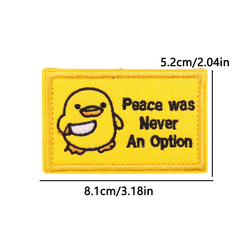 Yellow iron-on patch featuring a cartoon chick and the text Peace was Never An Option