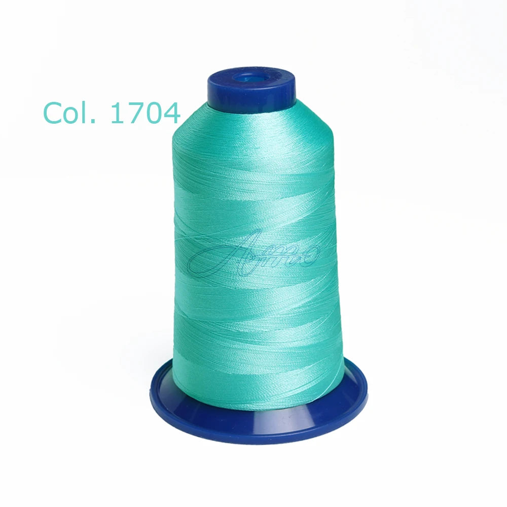 A spool of teal embroidery thread labeled Col. 1704 on a blue bobbin.