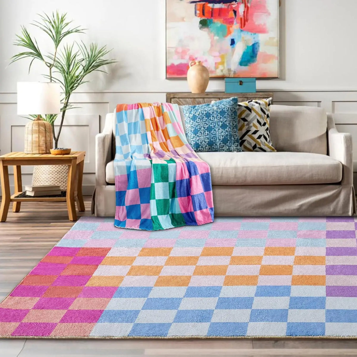 A colorful retro checkerboard geometric rug laid on a wooden floor in front of a sofa.