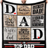 A black and gray graphic blanket featuring text celebrating a father with words like Dad, Hero, Legend, and Top Dad.