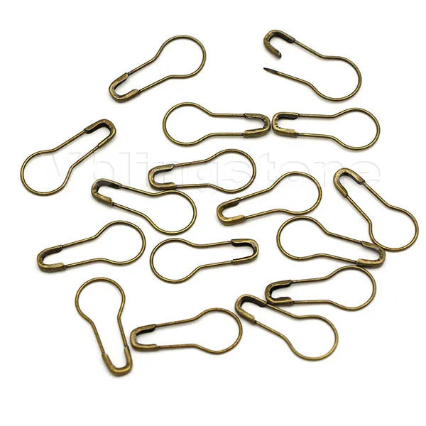 A collection of 100 gourd-shaped locking safety pins for knitting and sewing, made of brass or gold-toned metal.