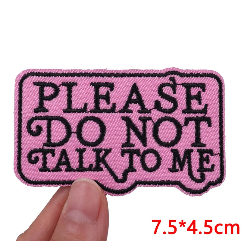 Pink embroidered patch with the text PLEASE DO NOT TALK TO ME