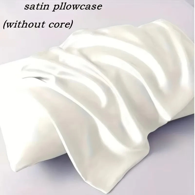 A white satin pillowcase is draped and folded, showing its smooth texture.