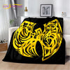 A black flannel throw blanket featuring a large yellow stylized eagle design.