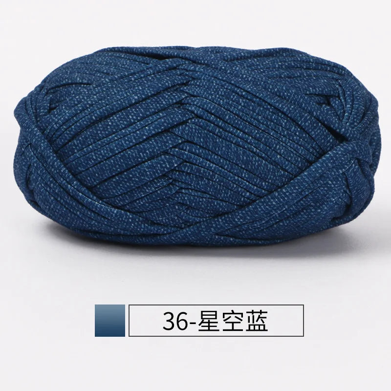A ball of dark blue hand-dyed fabric strip yarn for crochet and knitting.