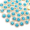 A close-up of sunflower crystal rhinestone sew-on buttons in shades of blue and gold.