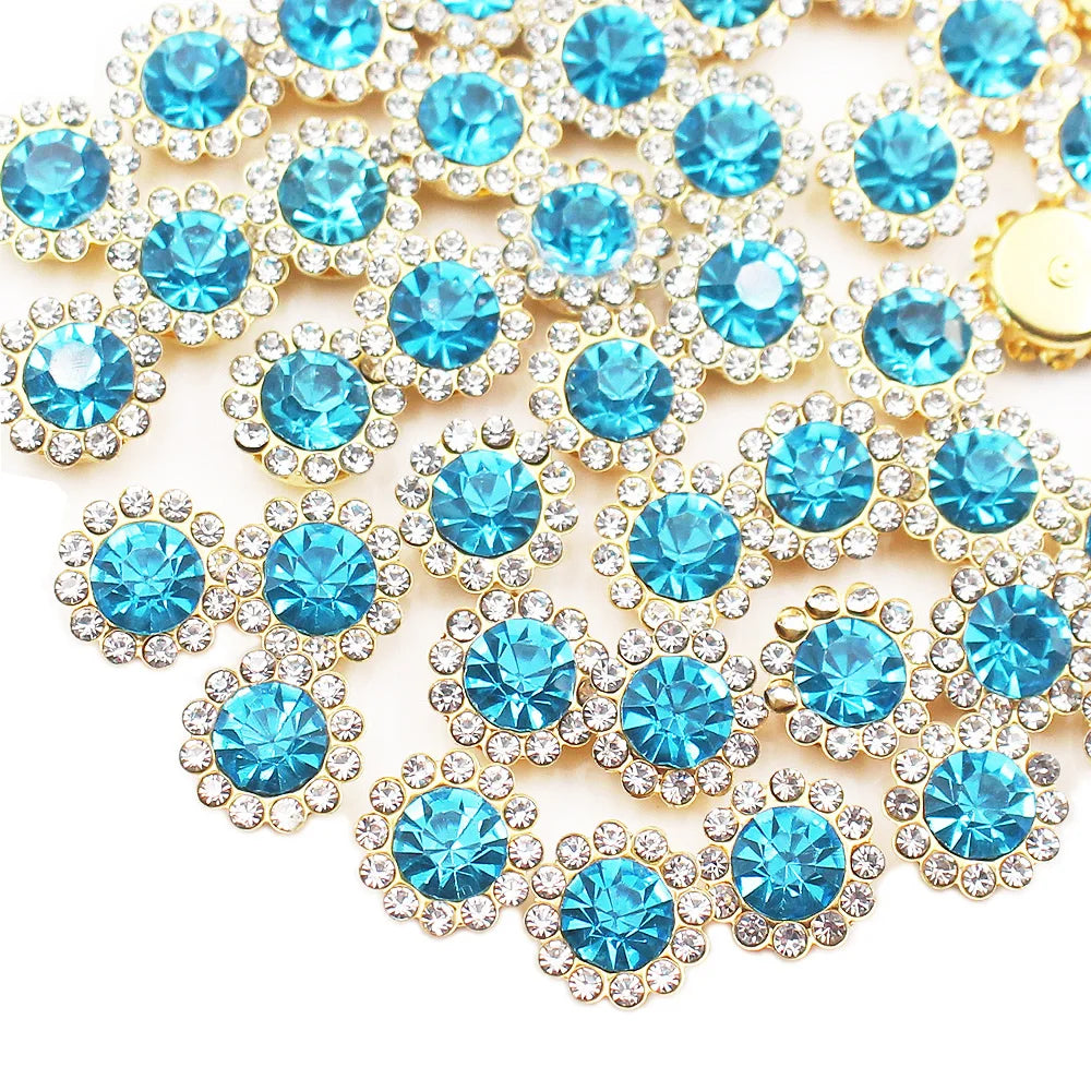 A close-up of sunflower crystal rhinestone sew-on buttons in shades of blue and gold.