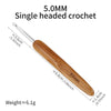 A wooden 5.0mm single headed crochet hook with a handle measuring approximately 3.6cm and a weight of 6.1g.
