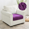 A white upholstered armchair with a purple velvet seat cover and a purple fabric accent.