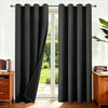 Black thermal insulated blackout curtains hanging on a rod in a doorway