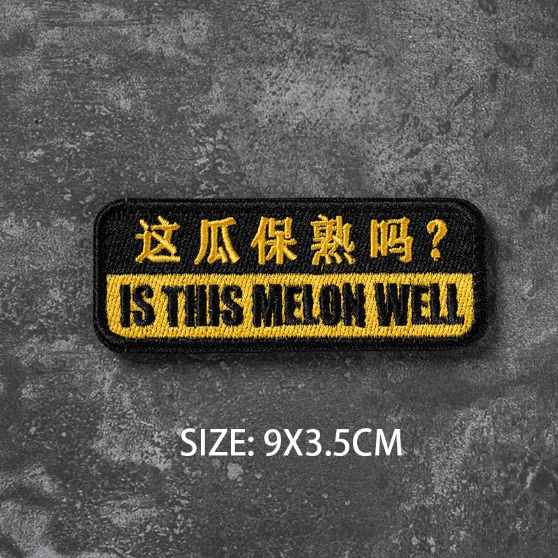 Black embroidered badge with yellow text asking Is this melon well