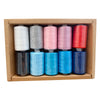 A box containing ten colorful polyester sewing thread spools in various shades of white, gray, pink, and red.